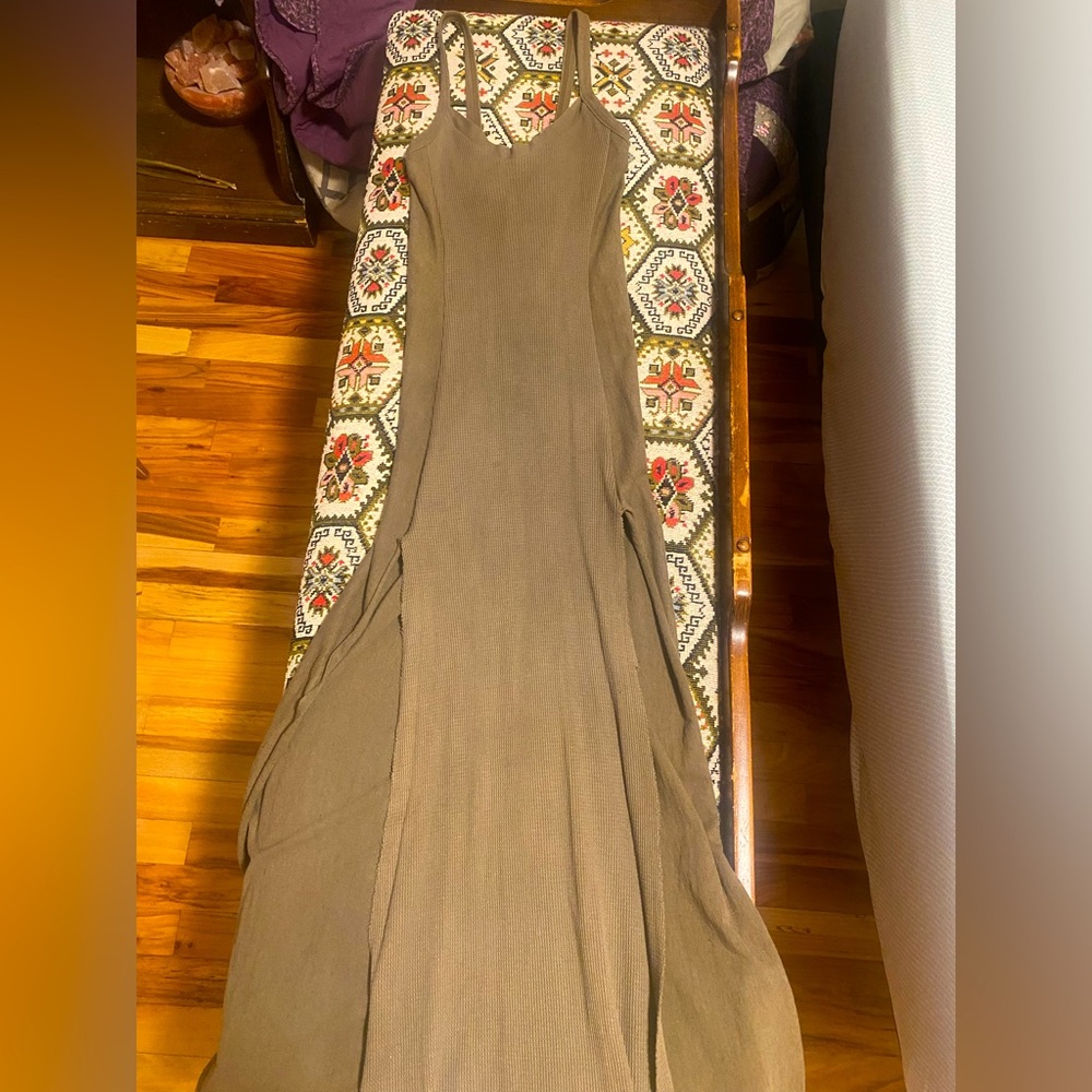 Family of Light designs long, strappy, dress, with high thigh slits.